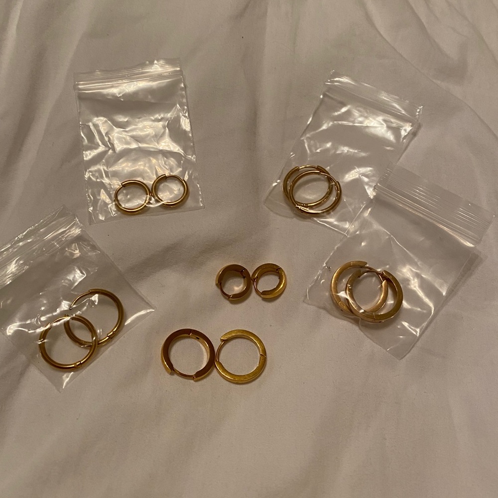 Seven total pairs gold huggie hoops new with tags